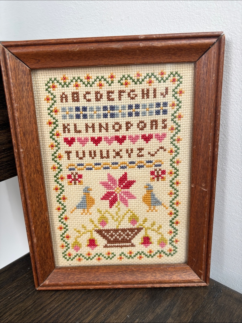 Vintage needlepoint sampler,birds/flower, wood frame, 6x8”